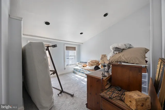 an empty room with windows and closet