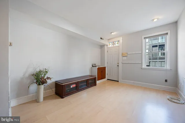 a view of an empty room with a window