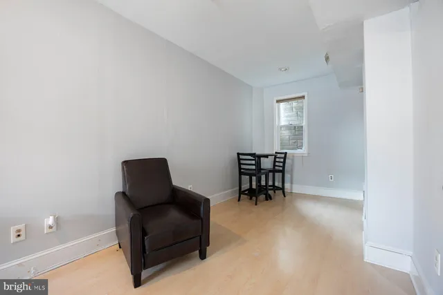 a work room with furniture and a window