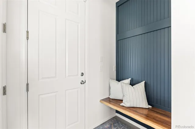 a view of a bedroom with wooden floor