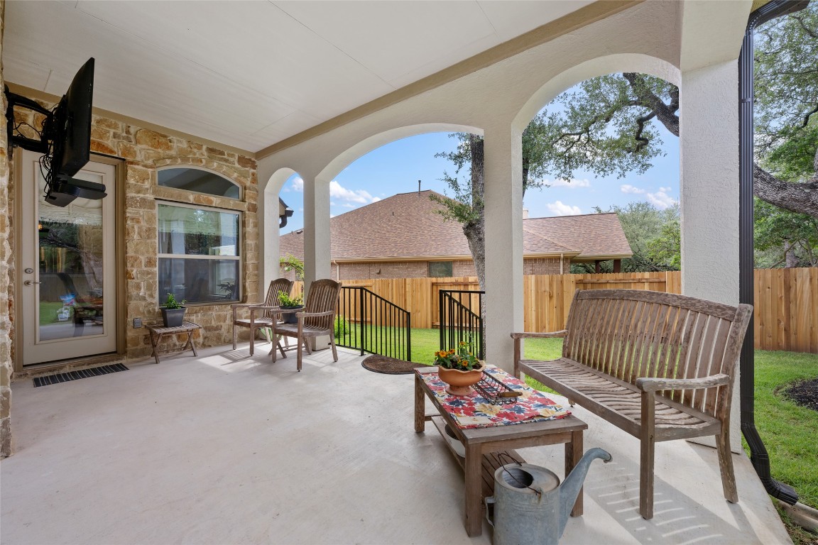 399 Whispering Wind Way Austin, TX 78737 - Photo 31 of 40 Fenced backyard featuring a patio
