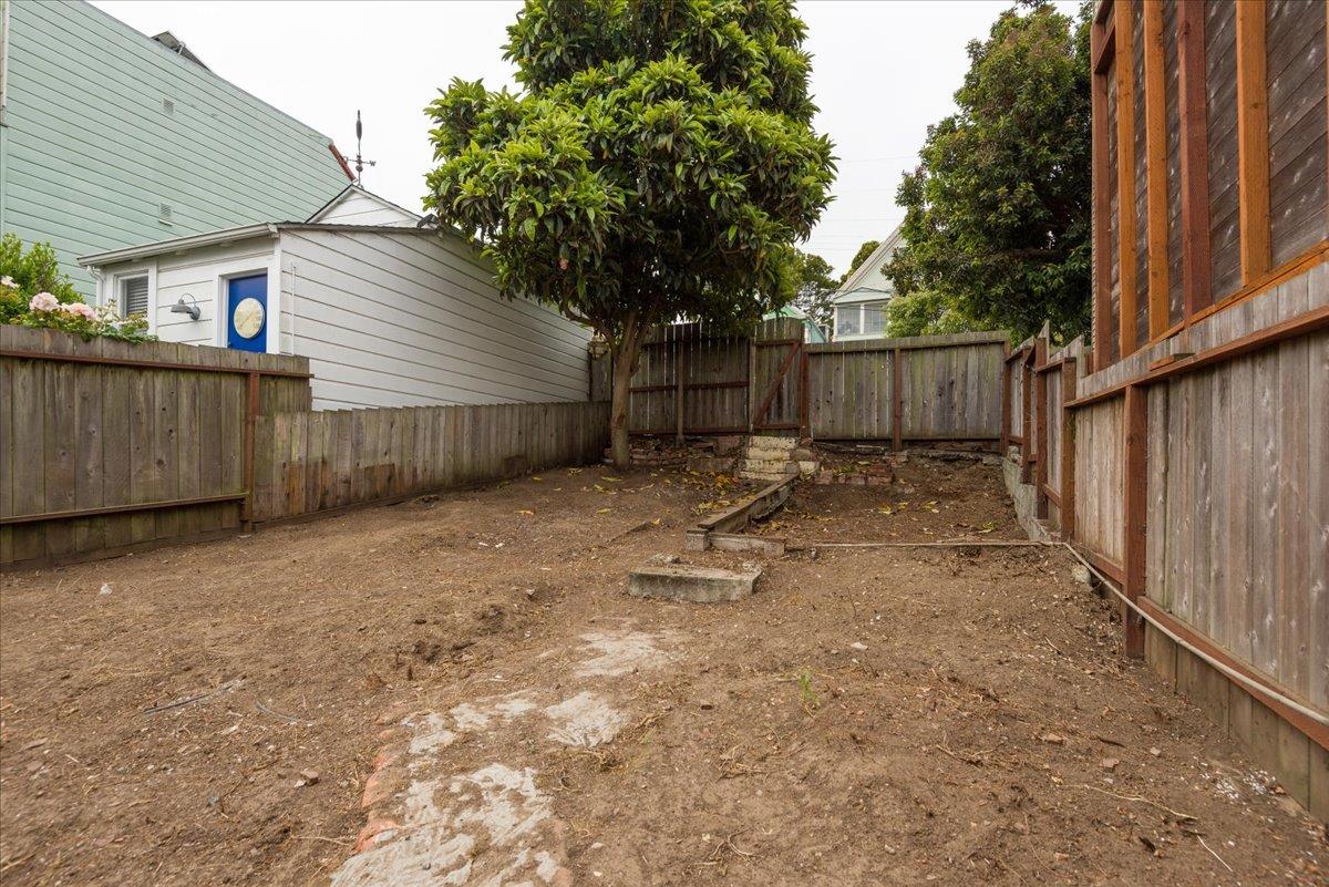 108 Cortland Avenue San Francisco, CA 94110 - Photo 13 of 27 a backyard of a house with a tree