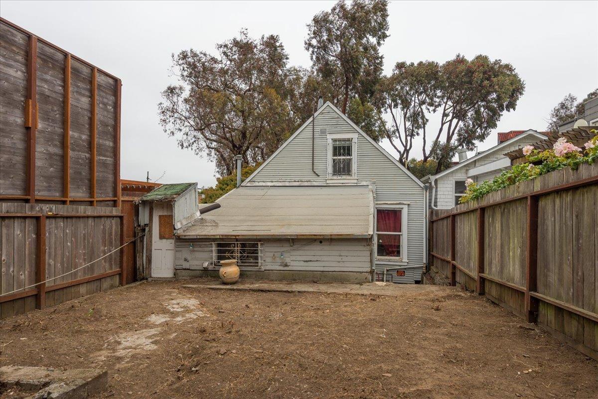 108 Cortland Avenue San Francisco, CA 94110 - Photo 14 of 27 a view of a small house with wooden fence