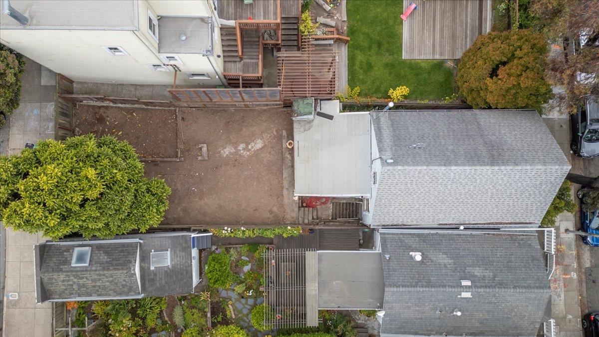 108 Cortland Avenue San Francisco, CA 94110 - Photo 20 of 27 an aerial view of a house with a yard and large tree