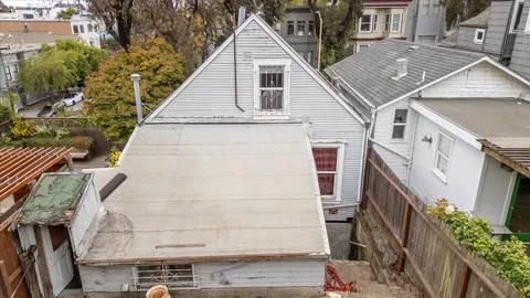 a aerial view of a house with a yard