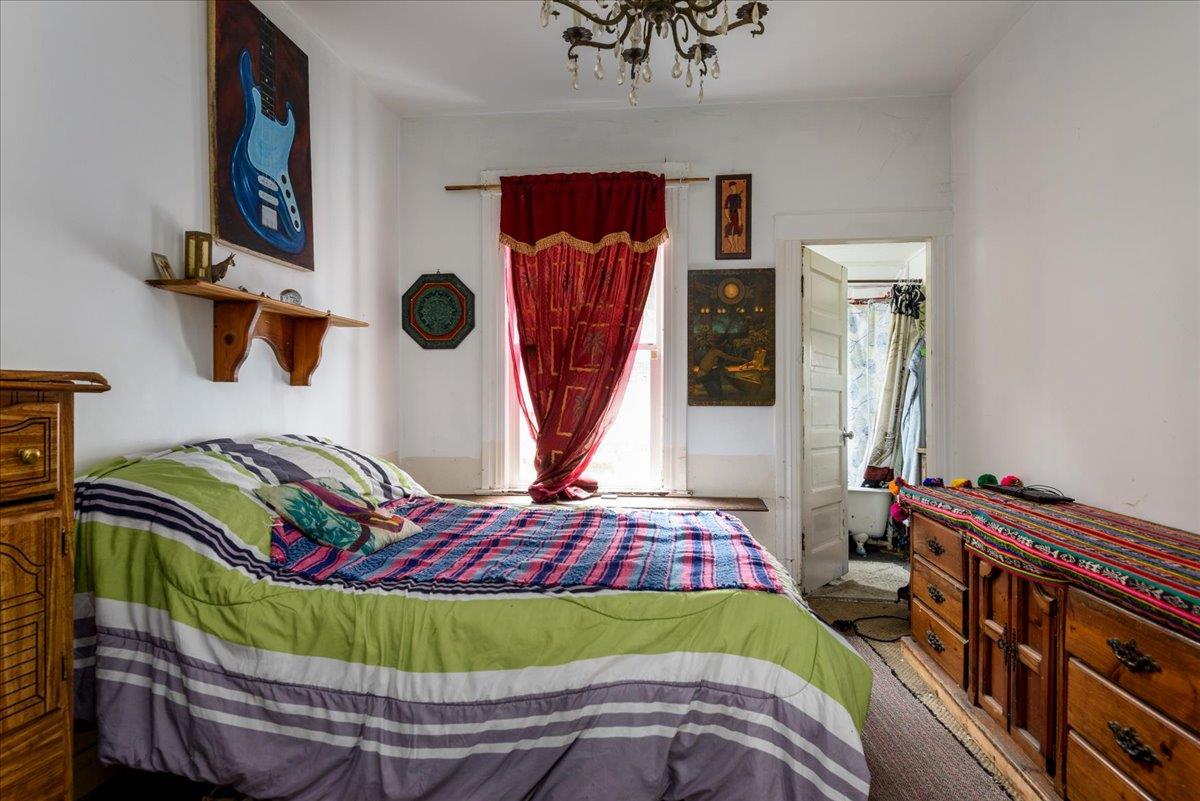 108 Cortland Avenue San Francisco, CA 94110 - Photo 8 of 27 a bedroom with a bed and a window