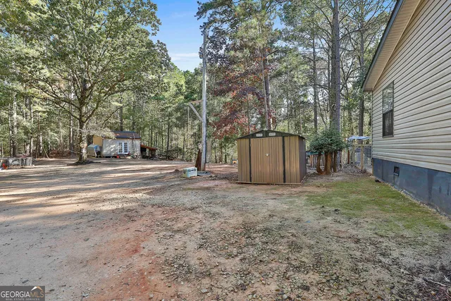 a view of a house with a yard and garage
