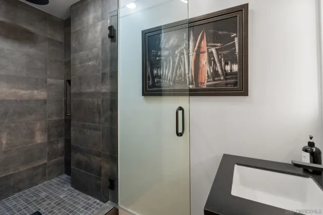 a patio with patio a couch and potted plants