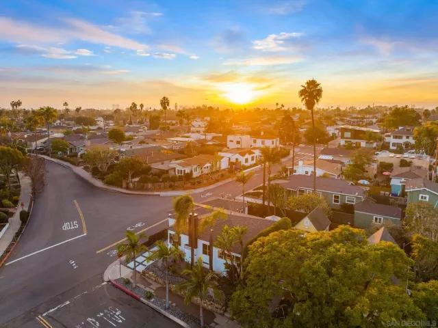 an aerial view of residential houses with outdoor space