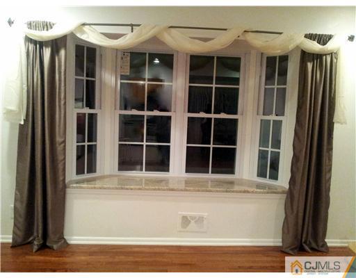 3 Monaghan Road Edison, NJ 08817 - Photo 13 of 16 a front view of a house with a window