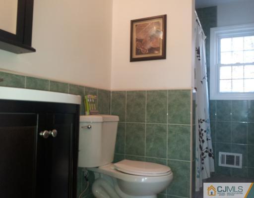 3 Monaghan Road Edison, NJ 08817 - Photo 14 of 16 a bathroom with a toilet and a shower