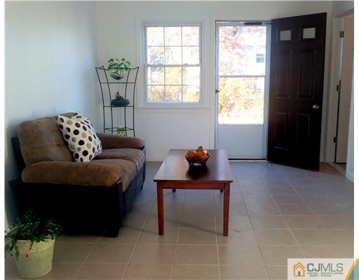 3 Monaghan Road Edison, NJ 08817 - Photo 6 of 16 a living room with furniture and a window