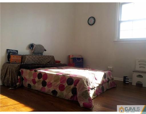 3 Monaghan Road Edison, NJ 08817 - Photo 10 of 16 a bedroom with a bed and a window