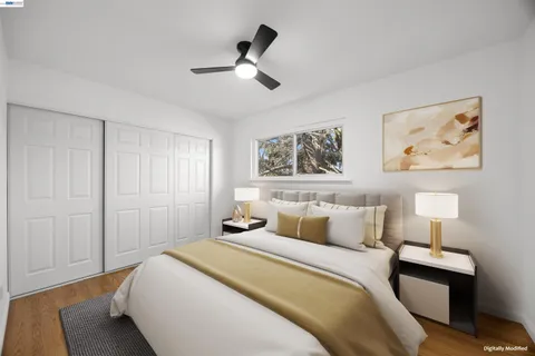 a bedroom with a bed and a lamp