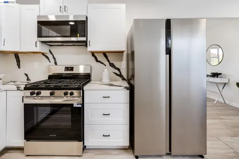 a kitchen with a stove and a microwave