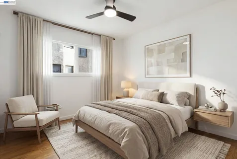 a bedroom with a bed and a couch