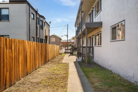 a view of a pathway both side of house
