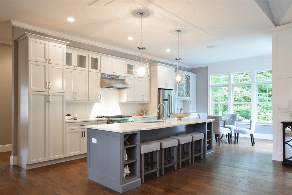 0 Diesel Lot-3 Lincoln, RI 02865 - Photo 8 of 10 a large kitchen with kitchen island a dining table chairs and wooden floor