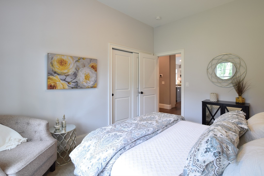 0 Diesel Lot-3 Lincoln, RI 02865 - Photo 10 of 10 a bedroom with a bed and a lamp on dresser