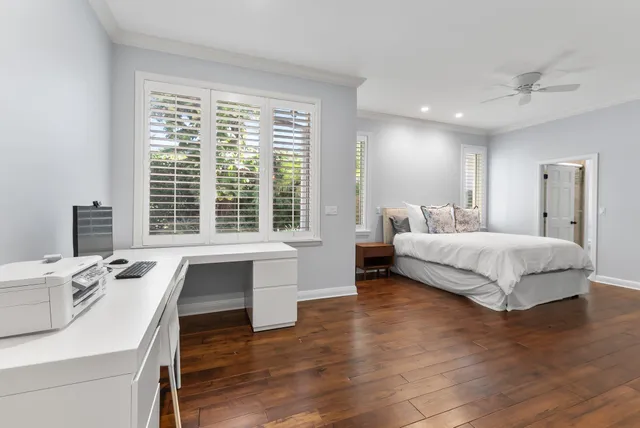 a bedroom with a large bed and a large window