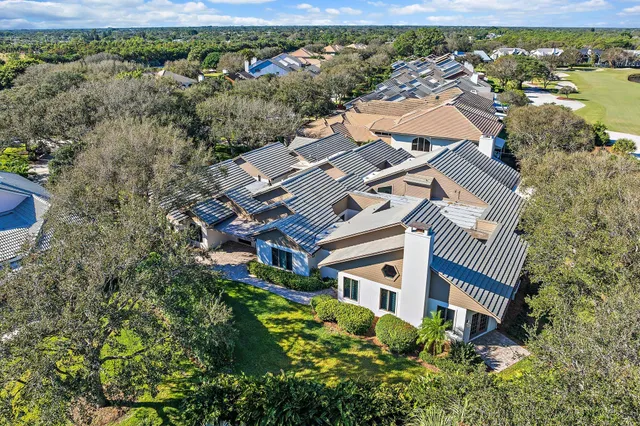 an aerial view of a house with a garden