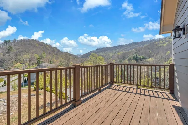 a view of a balcony with wooden floor