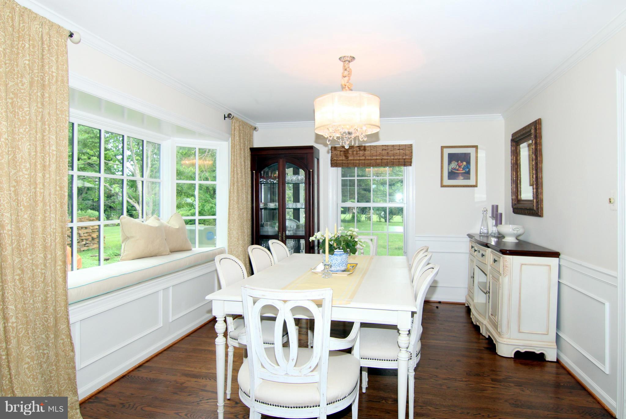 1001 Riva Ridge Drive Great Falls, VA 22066 - Photo 5 of 23 a view of a dining room with furniture a chandelier and wooden floor