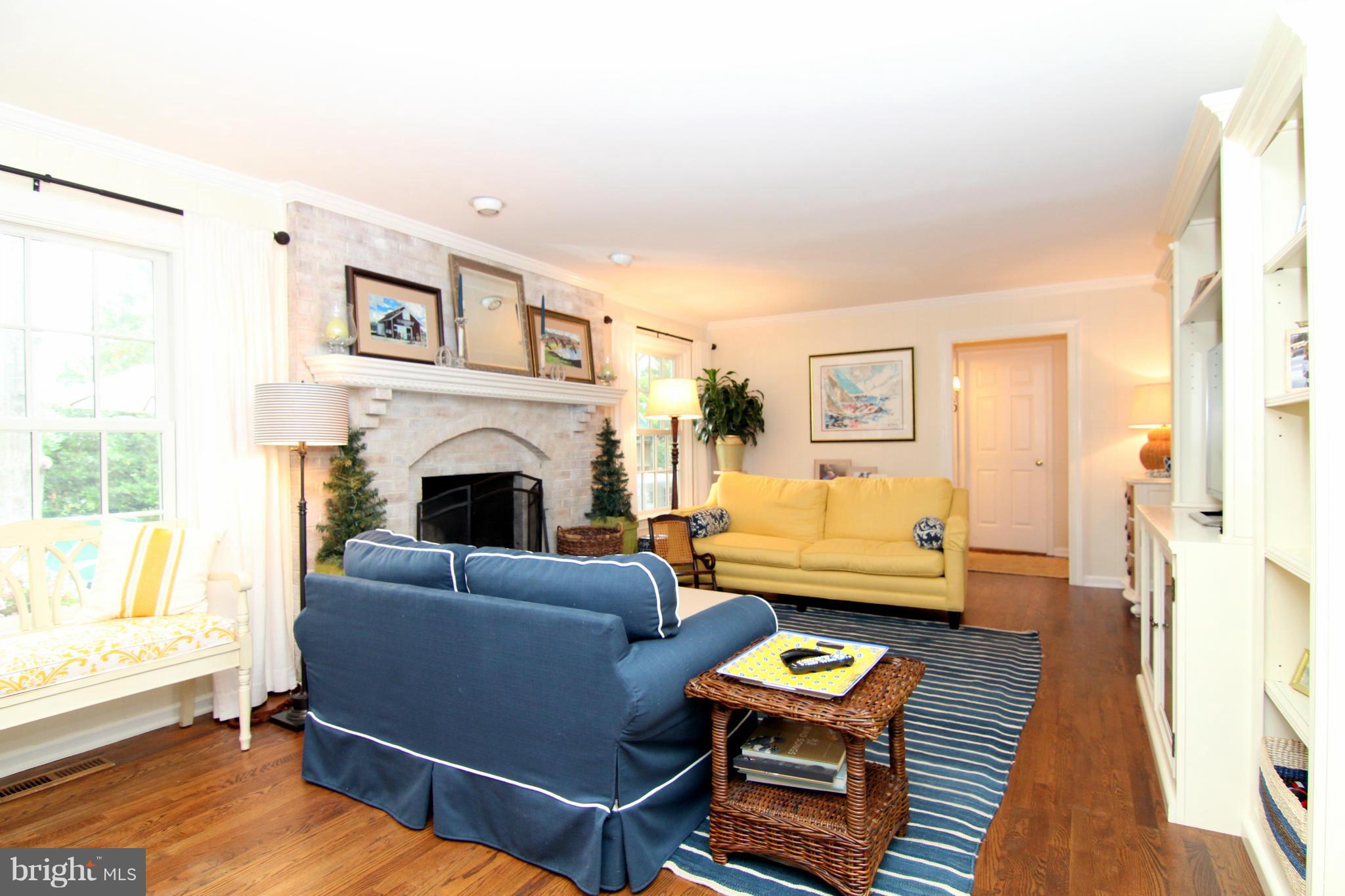 1001 Riva Ridge Drive Great Falls, VA 22066 - Photo 8 of 23 a living room with furniture and a fireplace with wooden floor