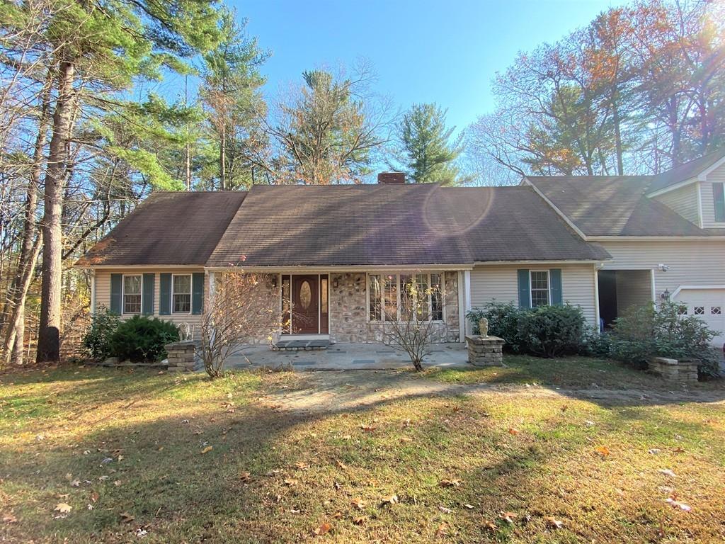 12 Crystal Hill Road Atkinson, NH 03811 - Photo 1 of 2 a front view of a house with a yard