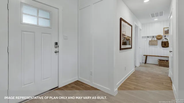 a bed room with a bed and a potted plant