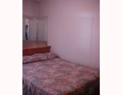 a bedroom with a bed and a closet