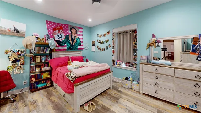 a bedroom with furniture and a bed