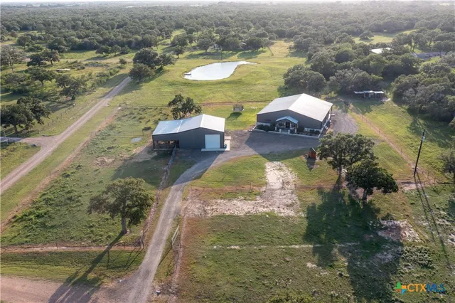 an aerial view of a house with a lake view