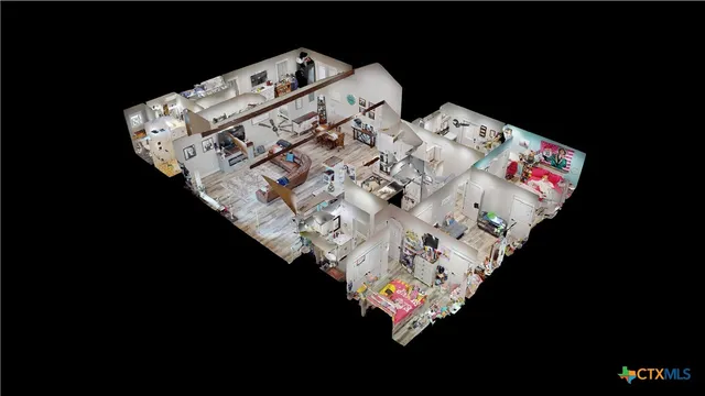 a bed with white sheets and a blanket