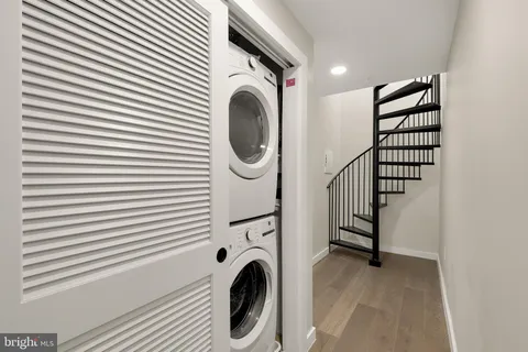 a view of a hallway with washer and dryer