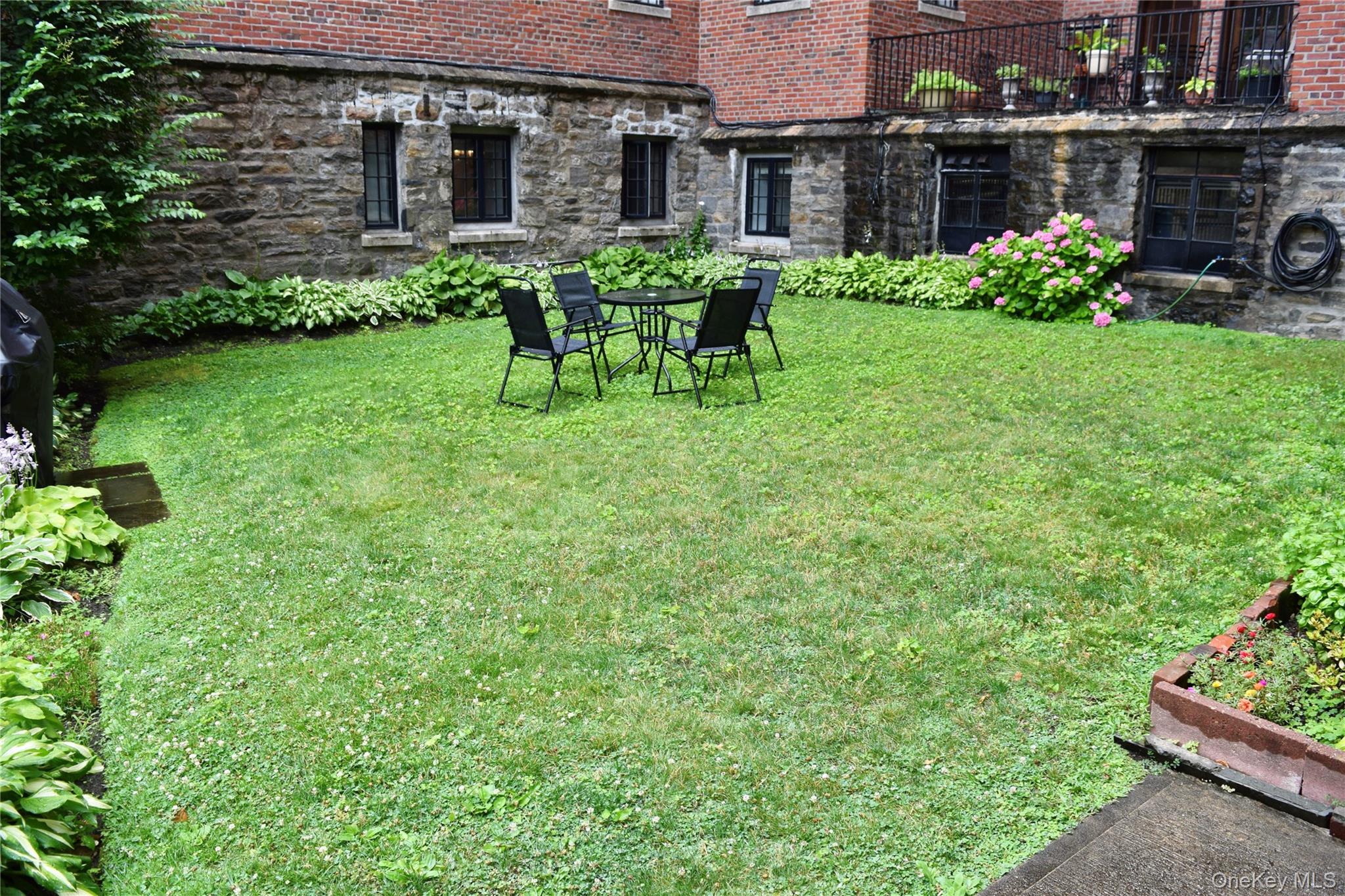 22 Sagamore Road, Unit A Bronxville, NY 10708 - Photo 6 of 13 Common garden area outside kitchen door.
