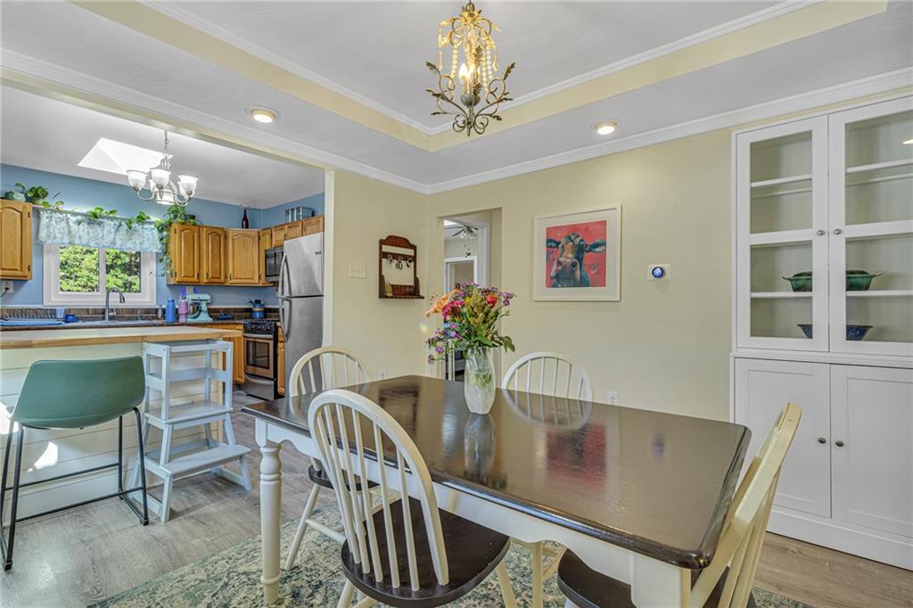 3430 37th St Extension Beaver Falls, PA 15010 - Photo 12 of 31 a view of a dining room with furniture window and wooden floor