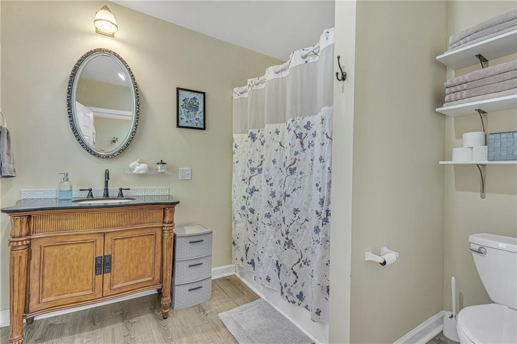 3430 37th St Extension Beaver Falls, PA 15010 - Photo 18 of 31 a bathroom with a granite countertop sink a toilet and a mirror