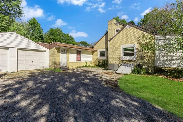 a view of a backyard with a garden and plants