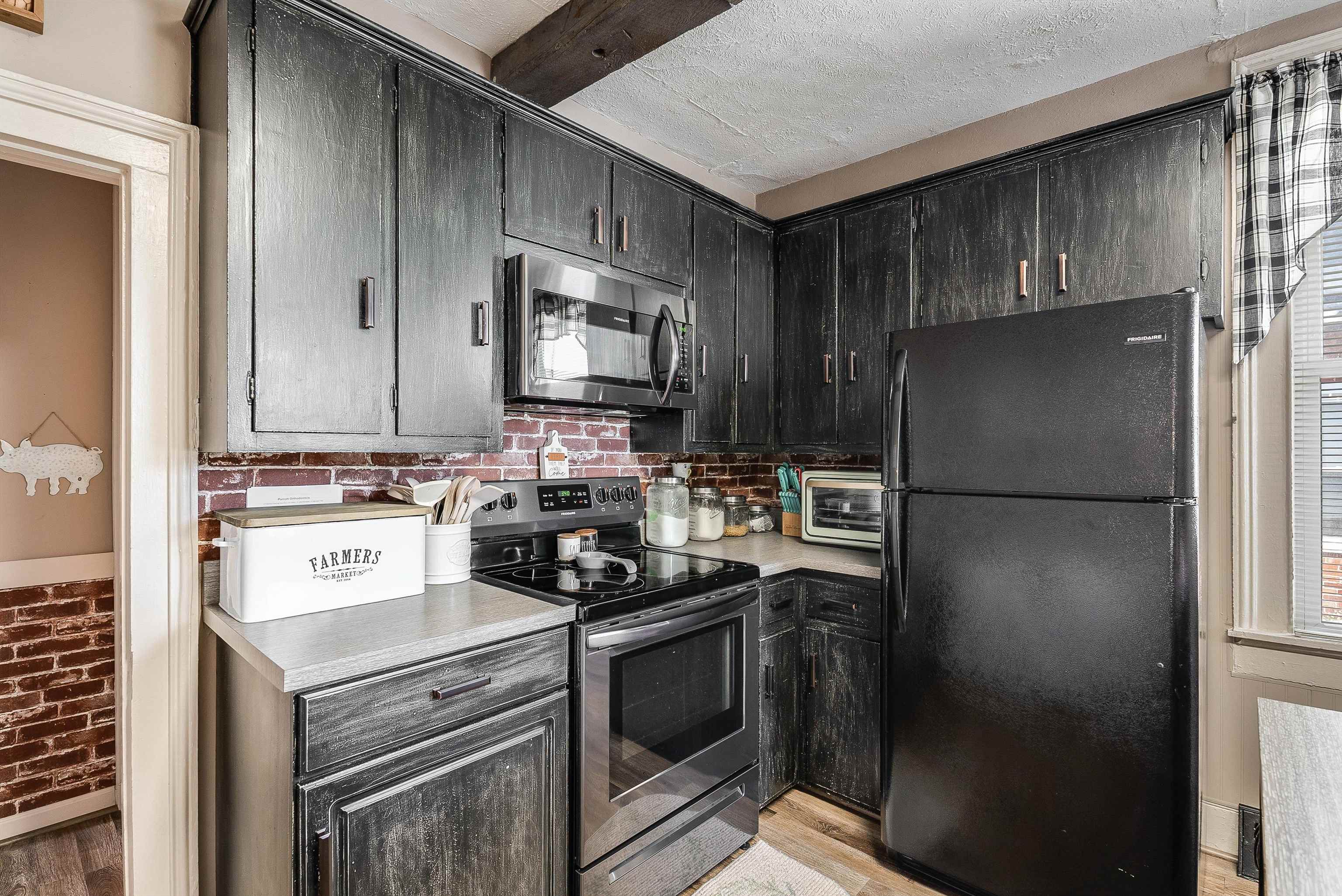 76 Main Street Greenville, VA 24440 - Photo 9 of 50 a kitchen with a refrigerator stove and microwave