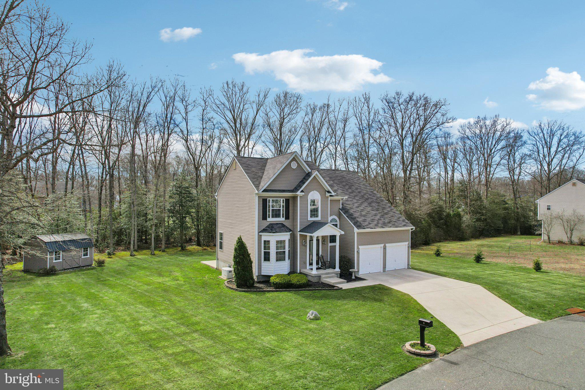 1 John's Way Bridgeton, NJ 08302 - Photo 11 of 57 a front view of a house with a yard and trees