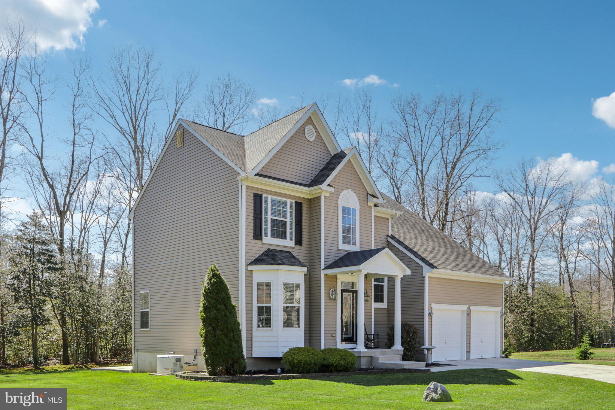 1 John's Way Bridgeton, NJ 08302 - Photo 2 of 57 a front view of a house with a yard and trees
