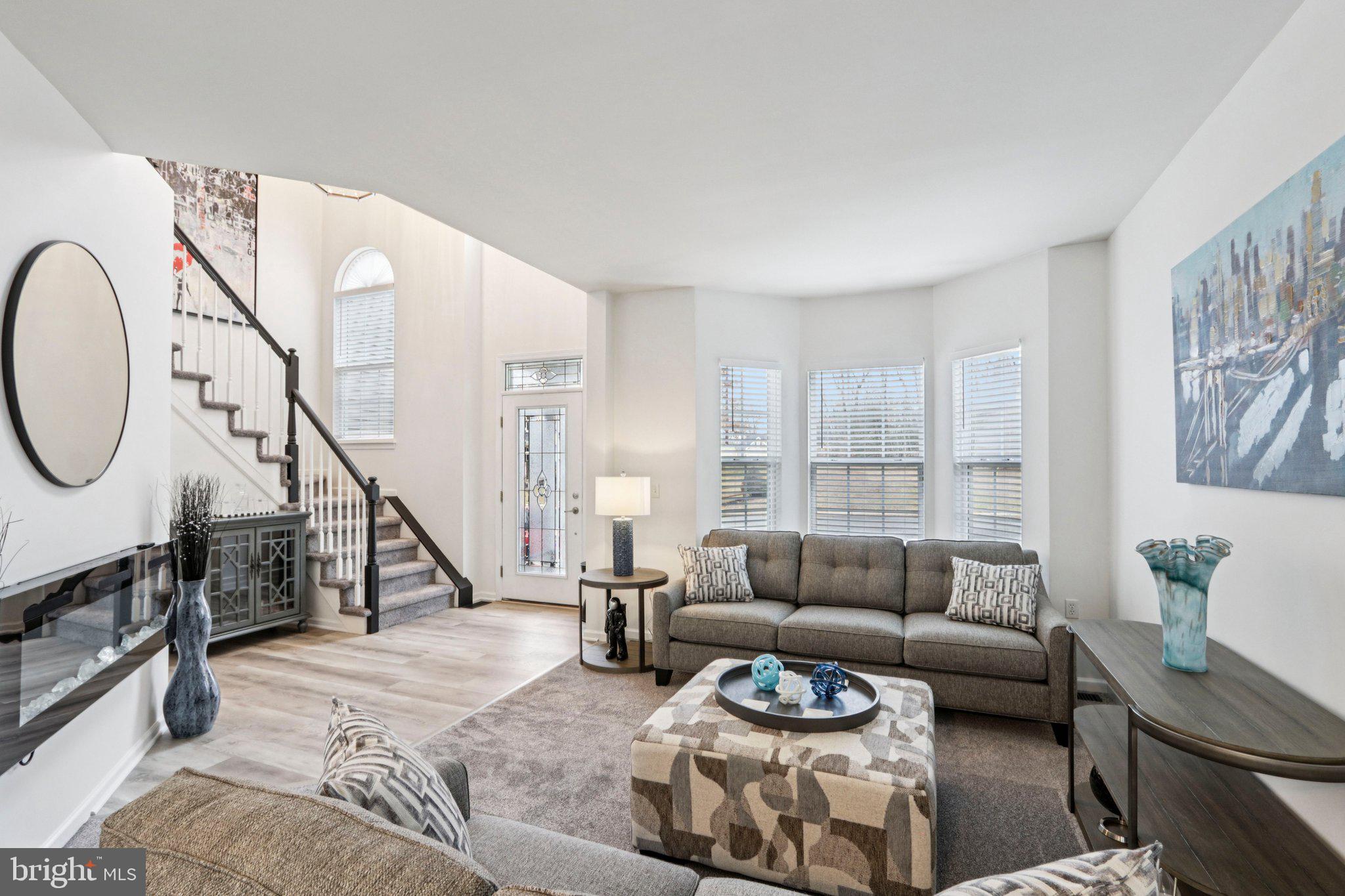 1 John's Way Bridgeton, NJ 08302 - Photo 21 of 57 a living room with furniture a wooden floor and a large window
