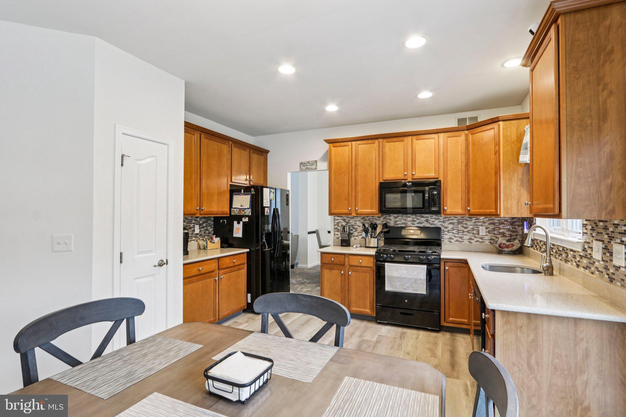 1 John's Way Bridgeton, NJ 08302 - Photo 29 of 57 a kitchen with stainless steel appliances granite countertop sink stove top oven and cabinets