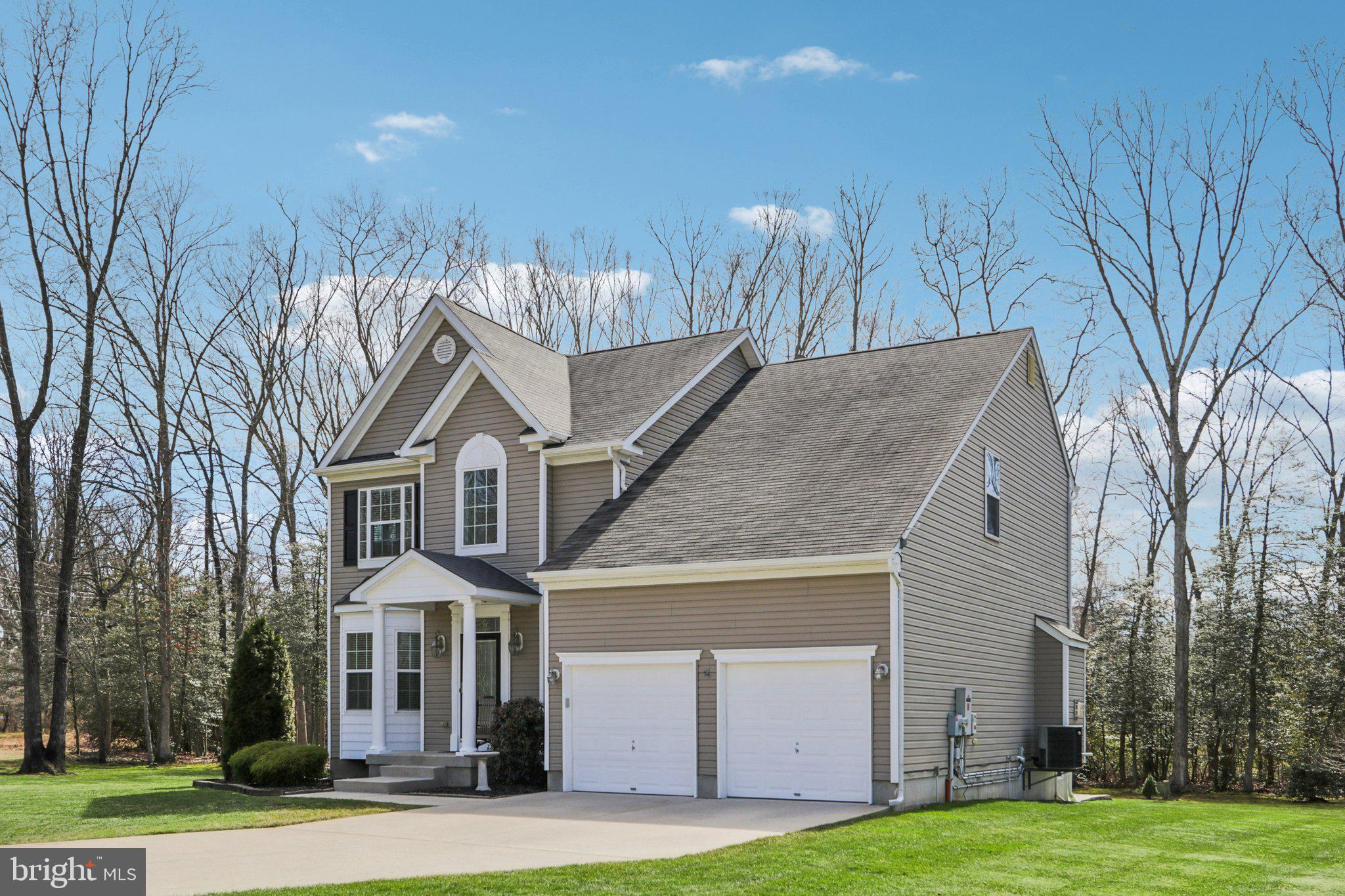 1 John's Way Bridgeton, NJ 08302 - Photo 3 of 57 a front view of a house with a yard and garage