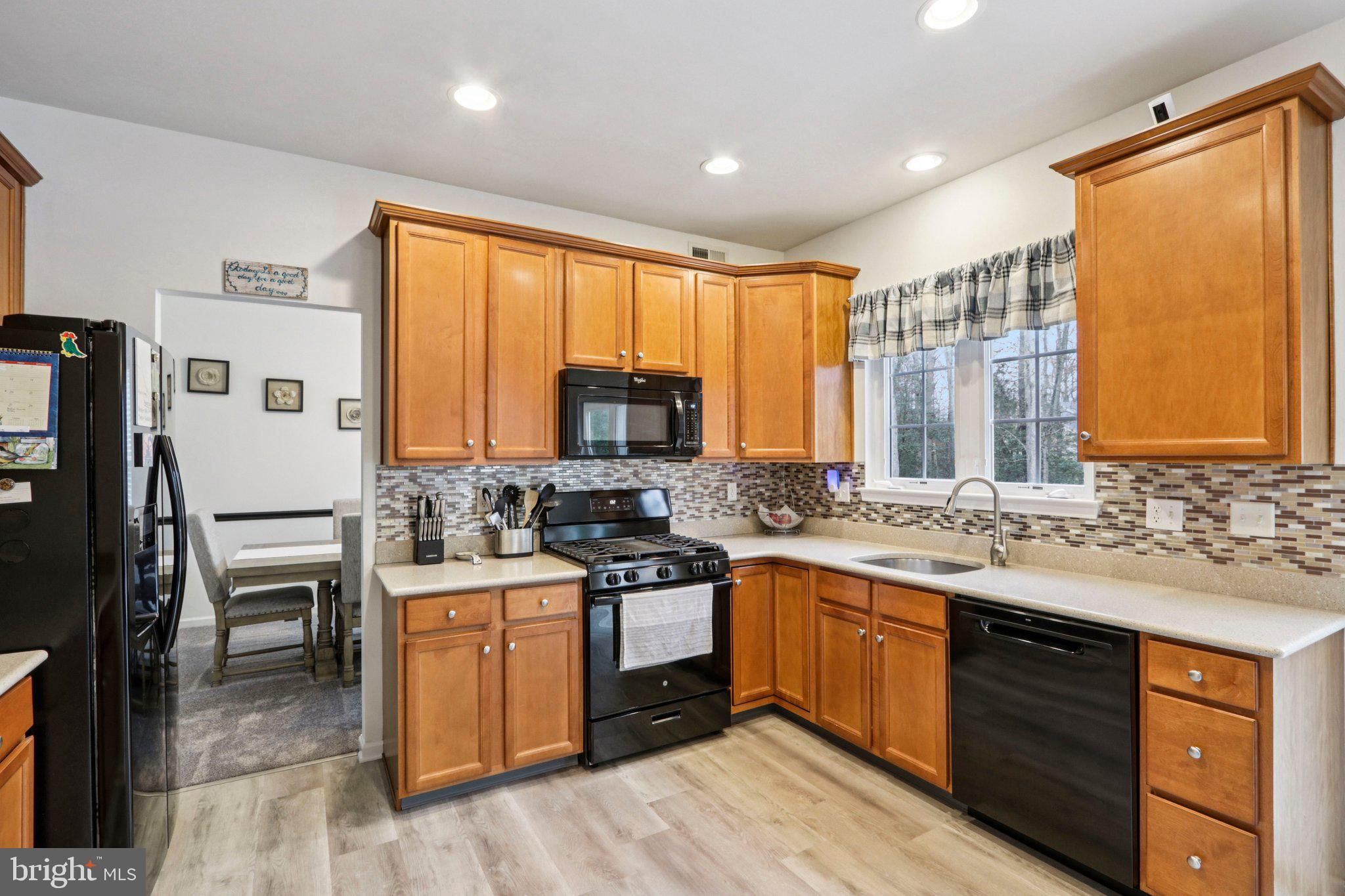 1 John's Way Bridgeton, NJ 08302 - Photo 31 of 57 a kitchen with a sink stove and refrigerator