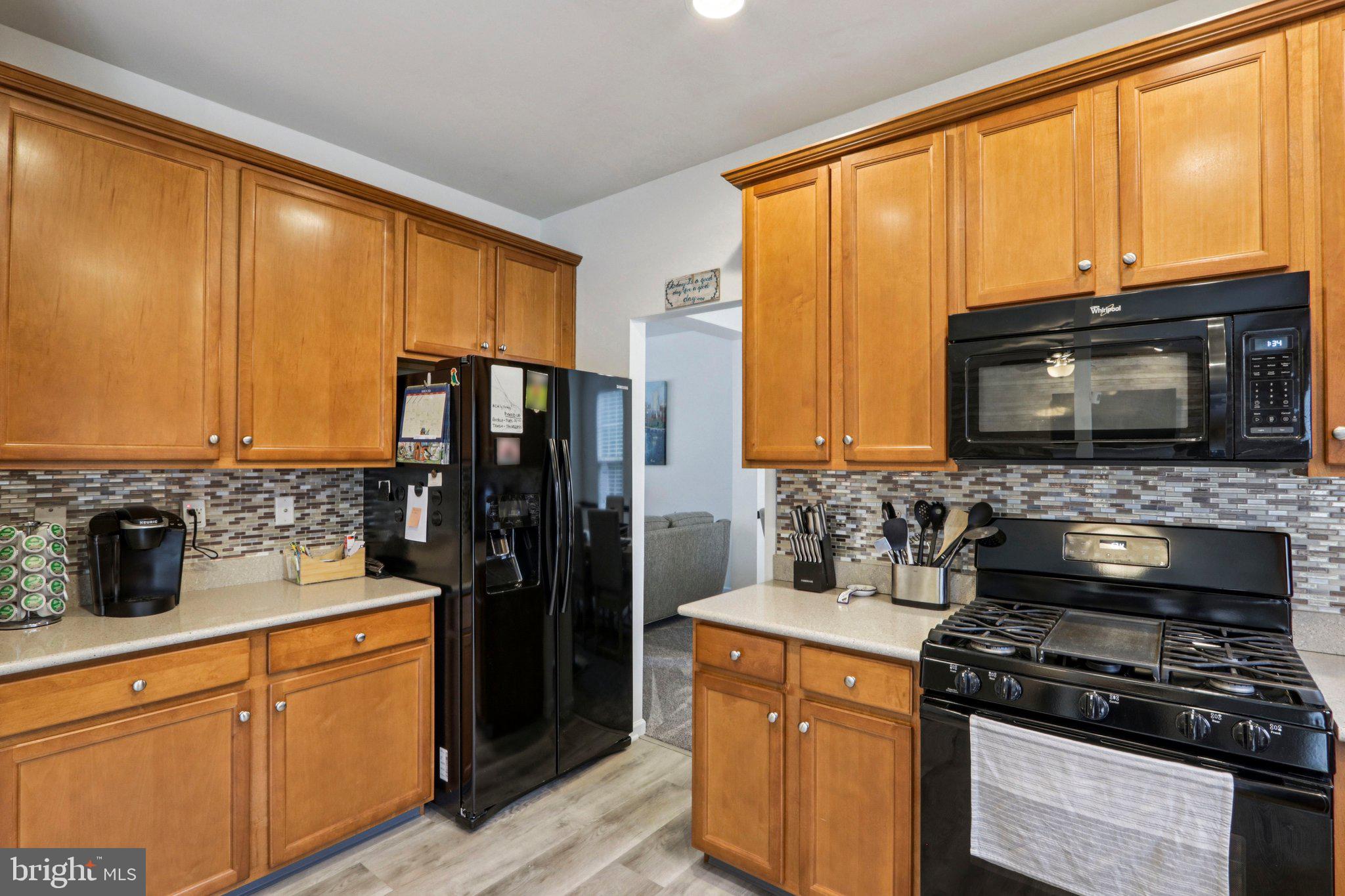 1 John's Way Bridgeton, NJ 08302 - Photo 32 of 57 a kitchen with stainless steel appliances a stove top oven and a refrigerator
