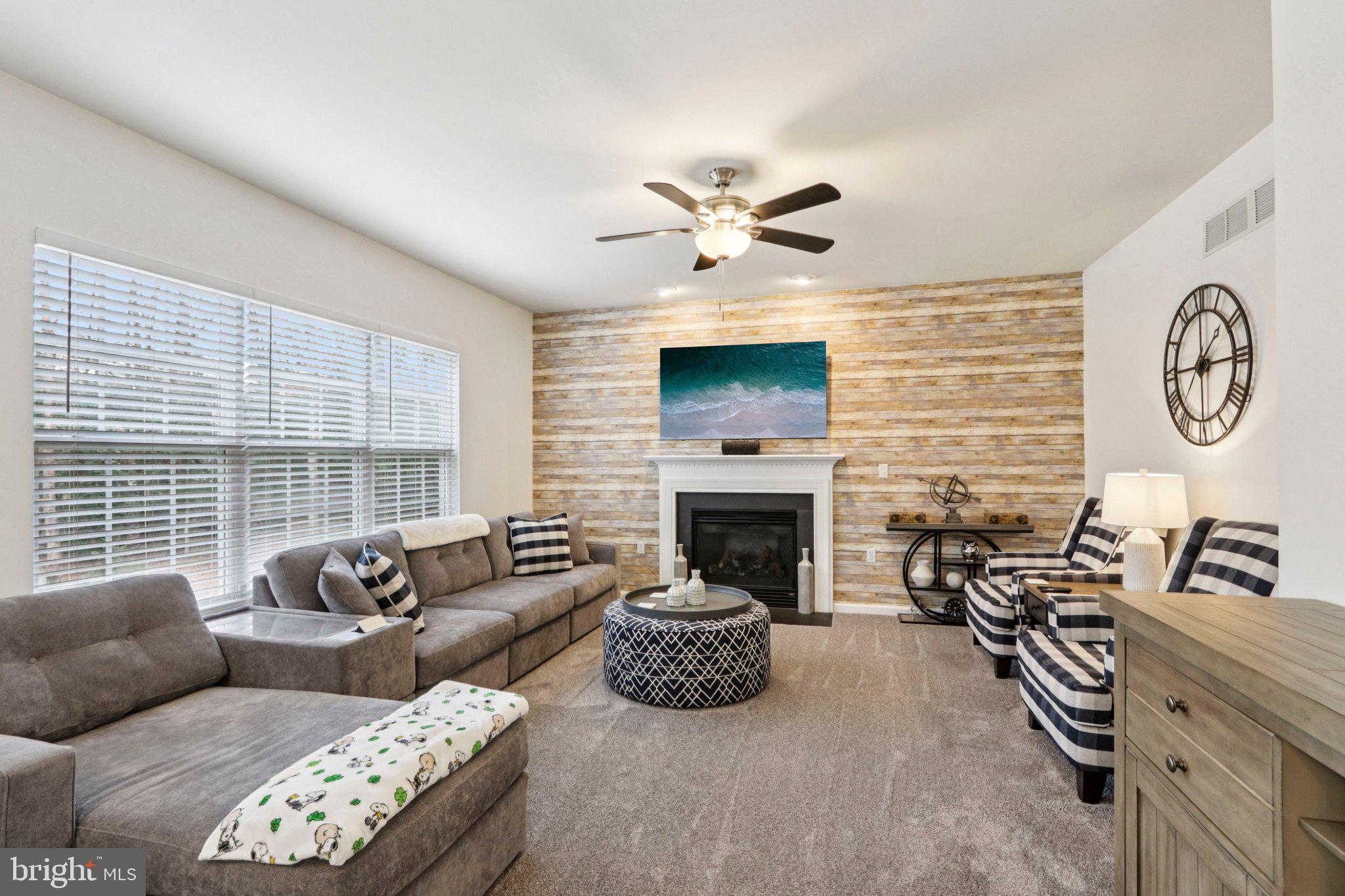 1 John's Way Bridgeton, NJ 08302 - Photo 35 of 57 a living room with furniture a large window and a fireplace