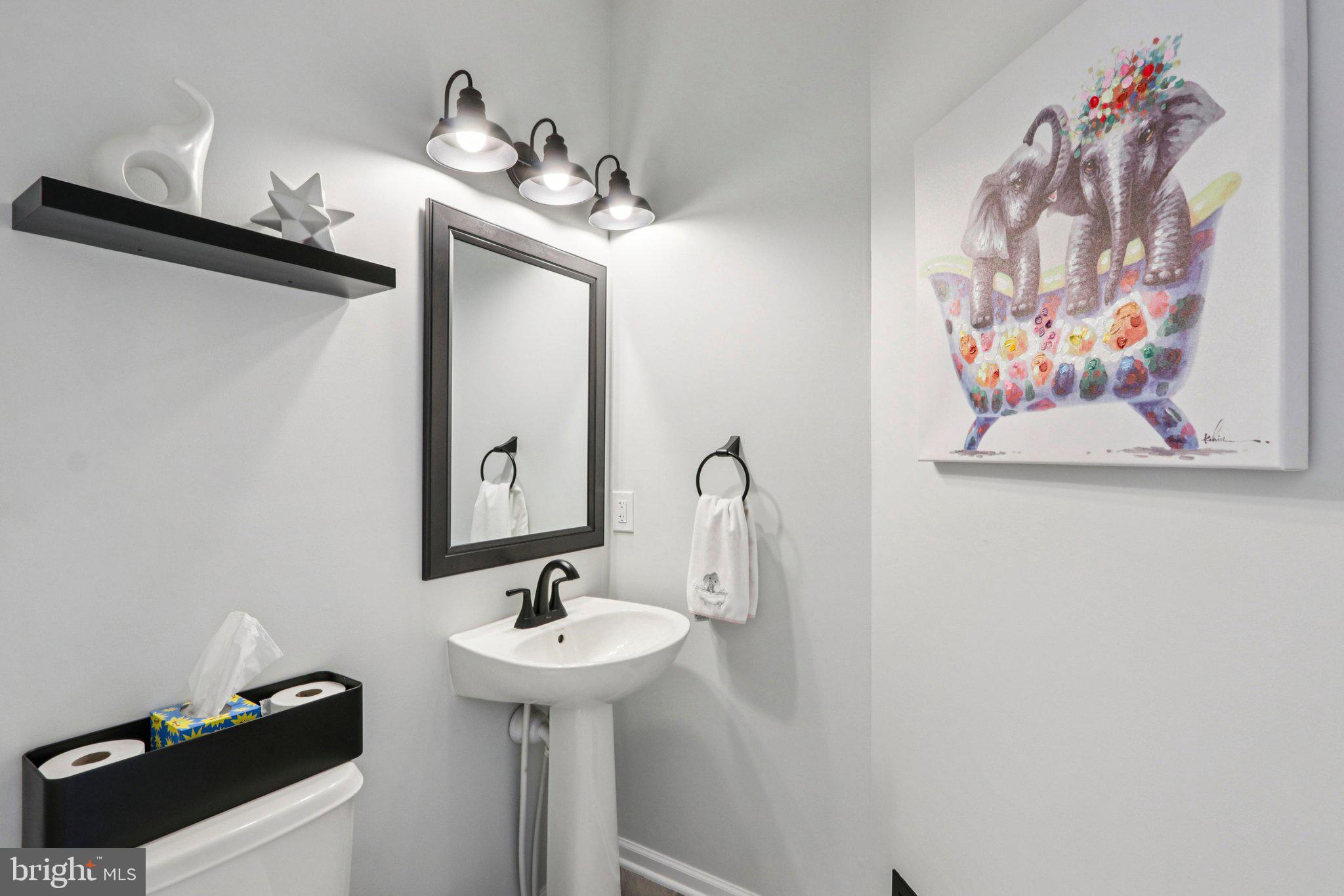 1 John's Way Bridgeton, NJ 08302 - Photo 36 of 57 a bathroom with a sink and a mirror