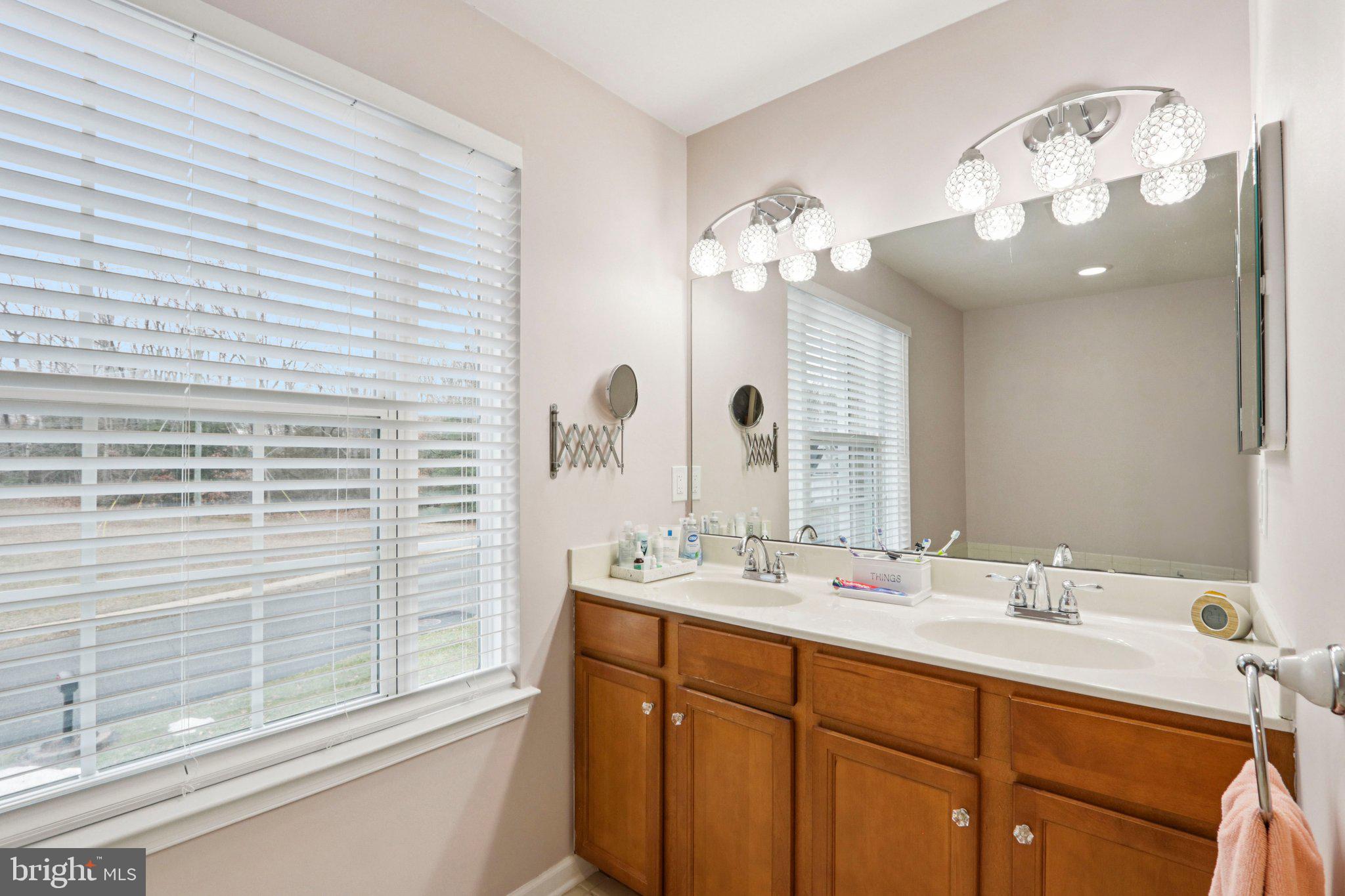 1 John's Way Bridgeton, NJ 08302 - Photo 41 of 57 a bathroom with a double vanity sink and a mirror